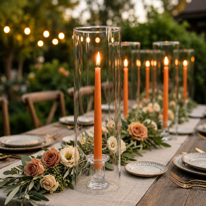 Orange taper candles in glass cylinder vases on a romantic outdoor tablescape - thumbnail number 5