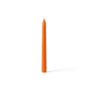 Single orange taper candle on white background - thumbnail number 1