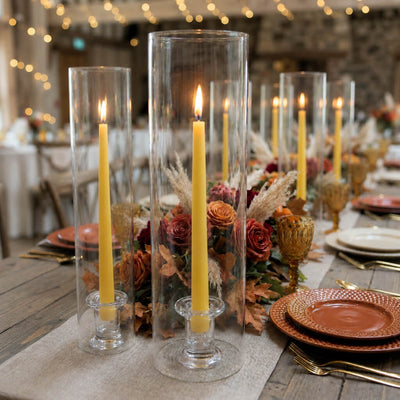 Fall tablescape with yellow candles, florals, and glass hurricane vases - thumbnail number 5