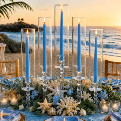 Light blue taper candles in glass holders on elegant beachside dinner table decor - thumbnail number 5