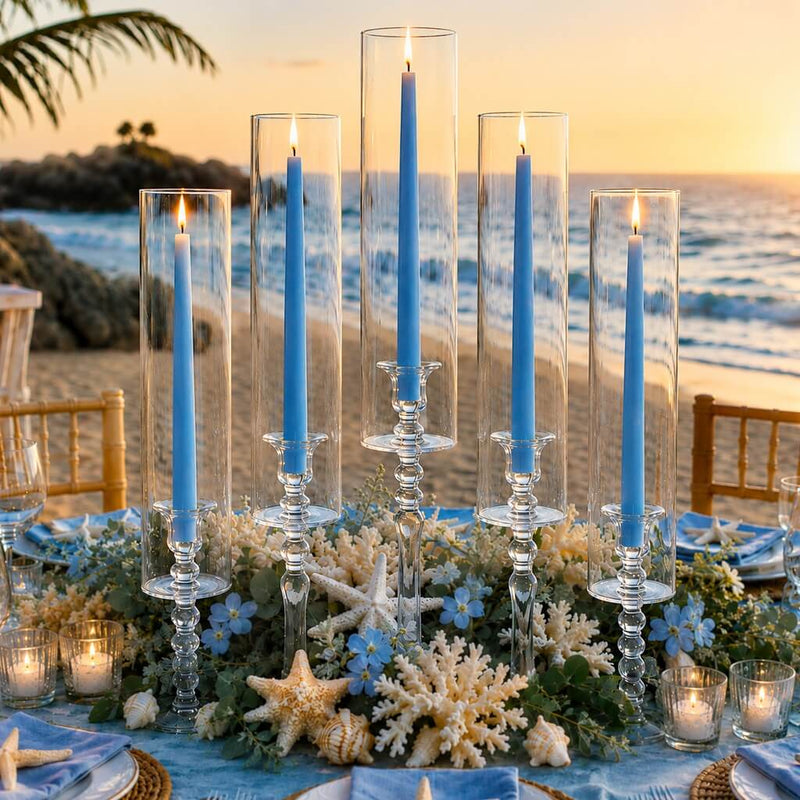 Light blue taper candles in glass holders on elegant beachside dinner table decor - thumbnail number 5
