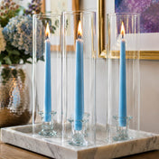 Light blue taper candles in glass cylinders on elegant marble tray decor - thumbnail number 7