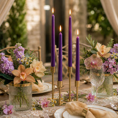 Lit purple taper candles with orchids and pastel floral table decor - thumbnail number 3