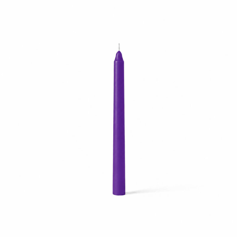 Single purple taper candle on white backdrop - thumbnail number 1