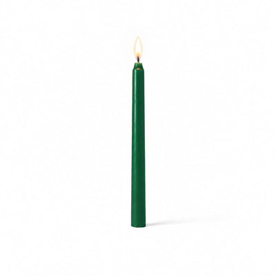 Green taper candle glowing on clean white background - thumbnail number 2