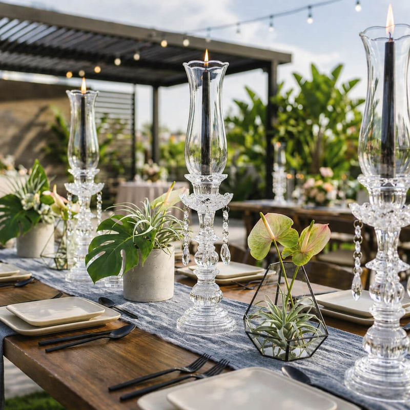 Black taper candles in crystal holders with tropical table decor - thumbnail number 3