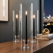 Elegant black taper candle in glass holder with city lights background - thumbnail number 6
