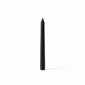 Single black taper candle on clean white backdrop - thumbnail number 1