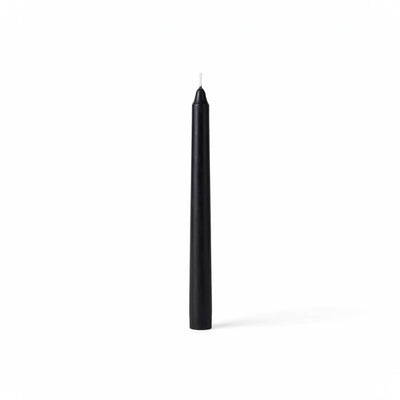 Single black taper candle on clean white backdrop - thumbnail number 1