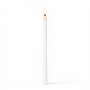 Lit white taper candle on white background - thumbnail number 2