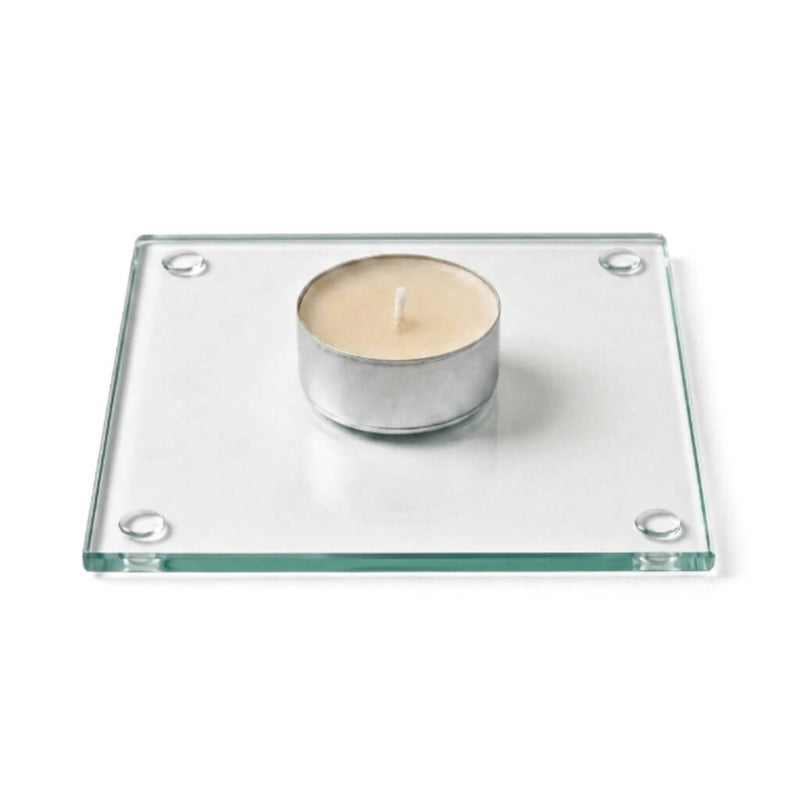 A clean product studio shot of an unlit candle sitting on a clear glass Square Coaster 4" - thumbnail number 2