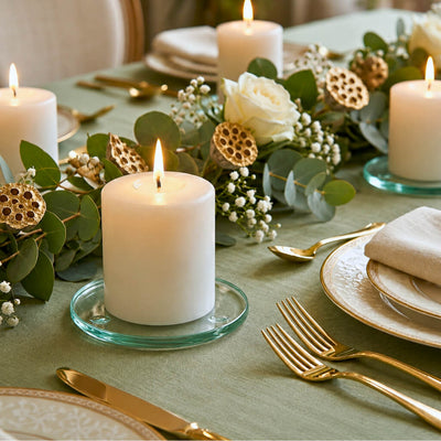 Lit white pillar on a Round Coaster 4" on an elegant tablescape with green linens and flowers - thumbnail number 8