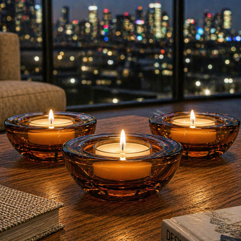 Three amber glass tealight holders on a wooden table against a nighttime city skyline backdrop - thumbnail number 8