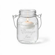Uncluttered Small Mason Jar with Handle and lit floating candle - thumbnail number 3