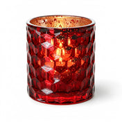 Red honeycomb glass votive holder with glowing candle on white background - thumbnail number 2