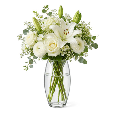 10" clear vase with white roses, lilies, and greenery - thumbnail number 2