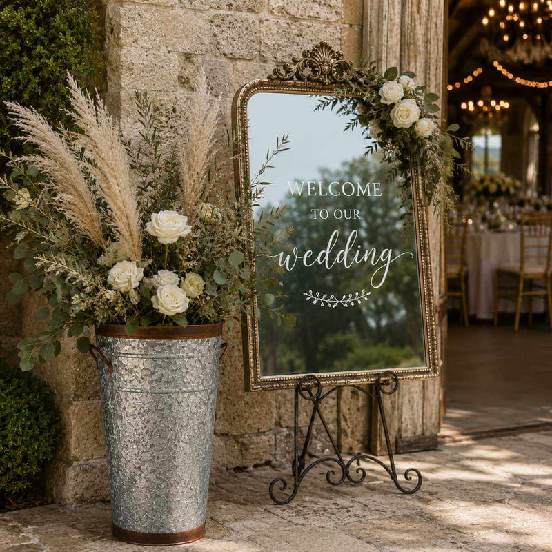 Two-tone French flower market bucket with pampas grass and white roses next to a wedding sign - thumbnail number 6