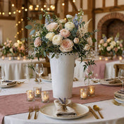 White scalloped flower market bucket filled with pastel roses and blue delphinium on a table - thumbnail number 3