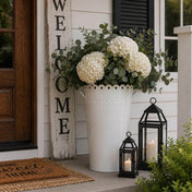 White enamel bucket filled with white hydrangeas and greenery on a porch - thumbnail number 8