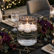 White floating candles lit inside a Wide Cylinder Vase on a luxury black and gold tablescape - thumbnail number 6