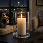 Wide Cylinder Vase holding a glowing candle next to stacked books against a blurred night scape - thumbnail number 8
