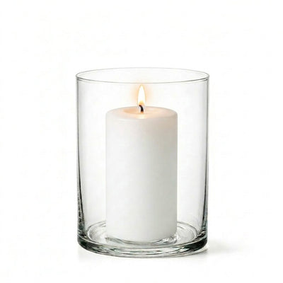 A lit white pillar candle burning cleanly inside a clear glass Wide Cylinder Vase - thumbnail number 3
