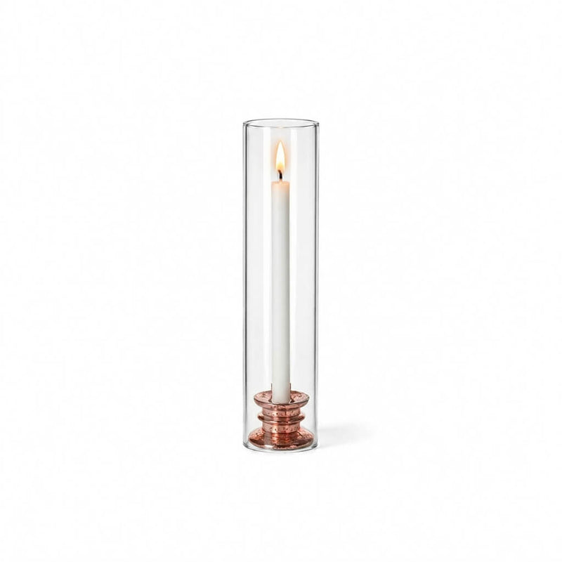 Glass Chimney Candle Shade 2.5" x 12" open tube over a lit taper candle on a solid white backdrop - thumbnail number 3