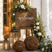 Grapevine topiary balls with a welcome sign, lanterns, and floral arrangements at an entrance - thumbnail number 3