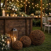 Grapevine topiary balls with lanterns and candles set up outside for an outdoor event - thumbnail number 4