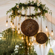 Grapevine topiary balls hanging with Edison bulbs from a floral hoop chandelier - thumbnail number 6