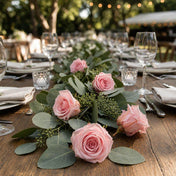 Pink preserved roses and eucalyptus garland on a wedding table setup - thumbnail number 3