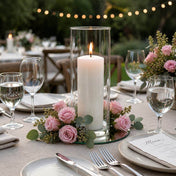 Pink preserved roses encircling a pillar candle in a glass cylinder centerpiece - thumbnail number 4