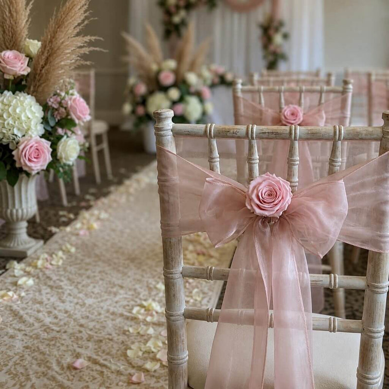 Chiavari chairs with pink rose and organza sashes at a wedding ceremony - thumbnail number 5