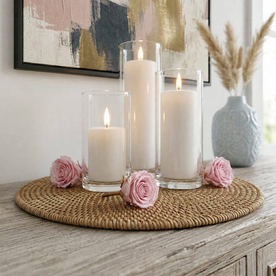 Pink preserved roses and pillar candles in glass holders on a woven placemat - thumbnail number 7