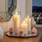 Pink preserved roses and pillar candles in glass holders on a mirrored tray - thumbnail number 9