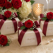Small white favor boxes decorated with red preserved roses and burgundy ribbon - thumbnail number 5