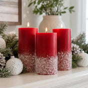 Three red pillar candles decorated with German glass glitter in a holiday setting - thumbnail number 9