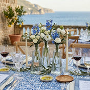 6 oz. pyramid glass bottles with blue and white flowers on a Mediterranean wedding table - thumbnail number 4