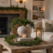 9ft faux boxwood garland arranged on a coffee table around a vase and candle - thumbnail number 9