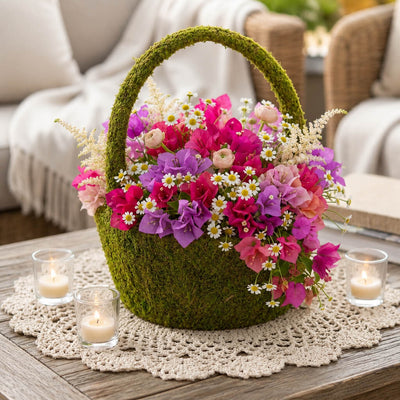 Moss basket filled with pink and purple flowers next to candles - thumbnail number 10