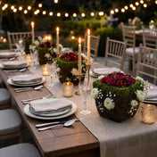 Wicker and moss square pots with red roses and candles on a dining table - thumbnail number 5