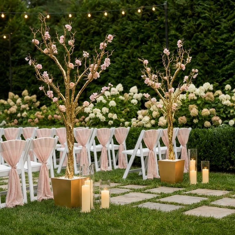 Two potted gold faux manzanita trees with pink flowers flanking outdoor seating - thumbnail number 4