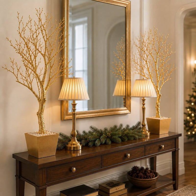 Two potted gold faux manzanita trees flanking a mirror on a console table - thumbnail number 10