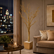 Potted gold faux manzanita tree in a luxury living room at night - thumbnail number 11