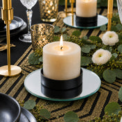 Lit pillar candle in a black holder on a 5 inch round mirror tray - thumbnail number 4
