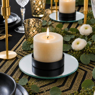 Lit pillar candle in a black holder on a 5 inch round mirror tray - thumbnail number 4