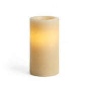 Ivory flameless LED pillar candle glowing on white background - thumbnail number 2