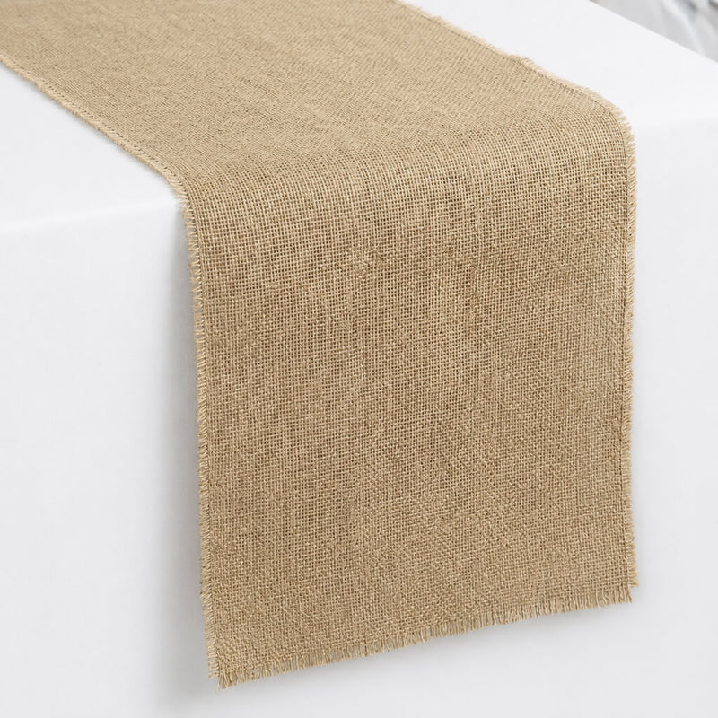 Burlap table runner draped over a white table - thumbnail number 1