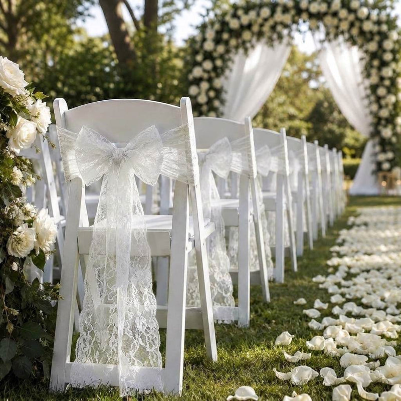 White Chantilly lace bows tied to white wedding chairs - thumbnail number 2
