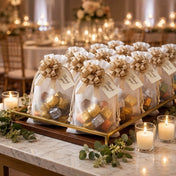 White favor bags with gold burlap pull bows and thank you tags filled with candies - thumbnail number 3